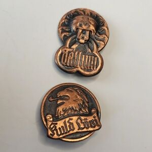 Set of 2 vintage copper and black Lion pin brooches